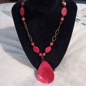 Orange shell and orange bead necklace